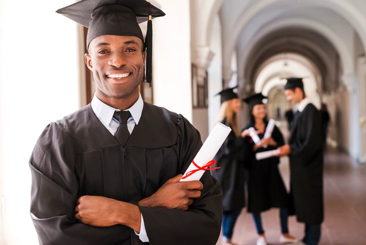 college graduate holding his diploma | Bowser Subaru in Pittsburgh PA